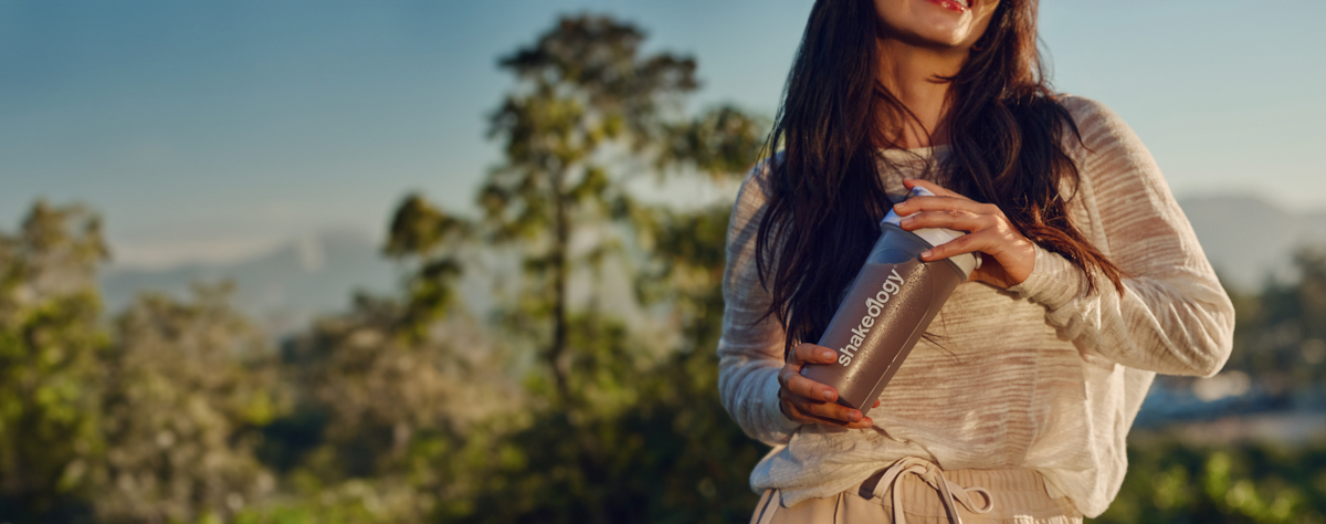 woman holding Shakeology